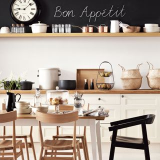 scandi style kitchen with dining table and wooden chairs, blackboard paint