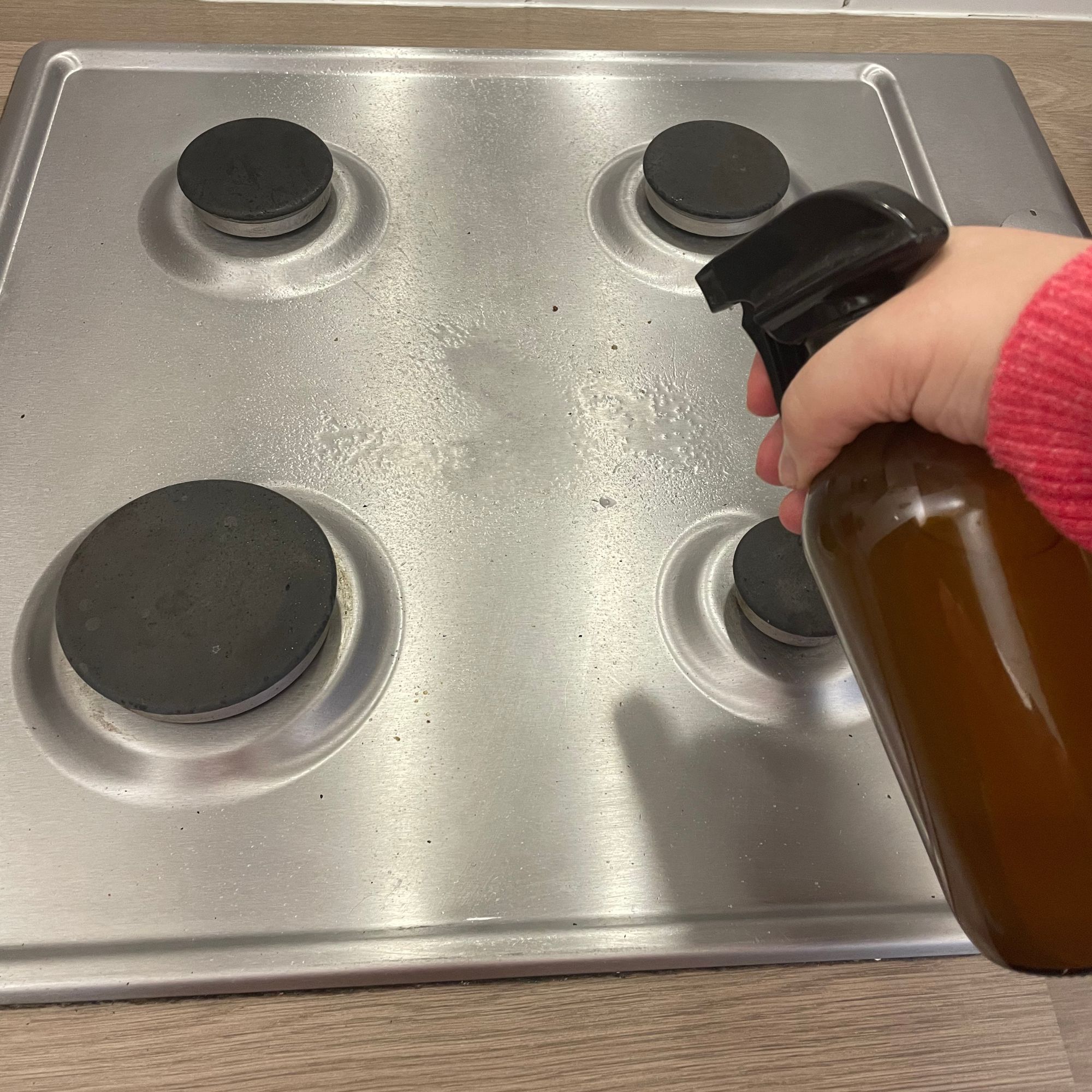 Spraying rice water onto a hob