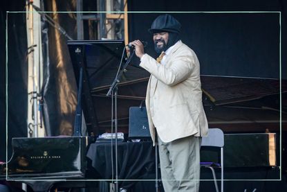 Gregory Porter wearing his hat while performing on stage