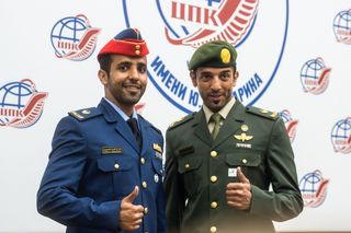 United Arab Emirates astronauts Hazzaa AlMansoori and Sultan AlNeyadi during pre-launch traditions for the Russian Soyuz vehicle.