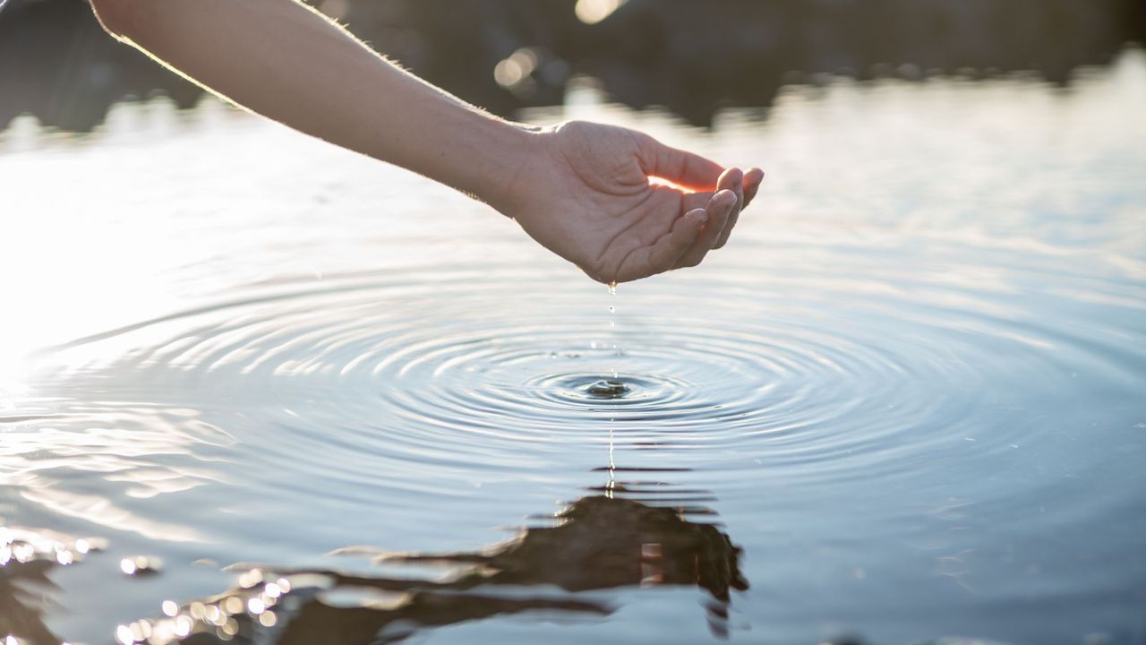 Best K-Beauty Skincare - hand skimming water