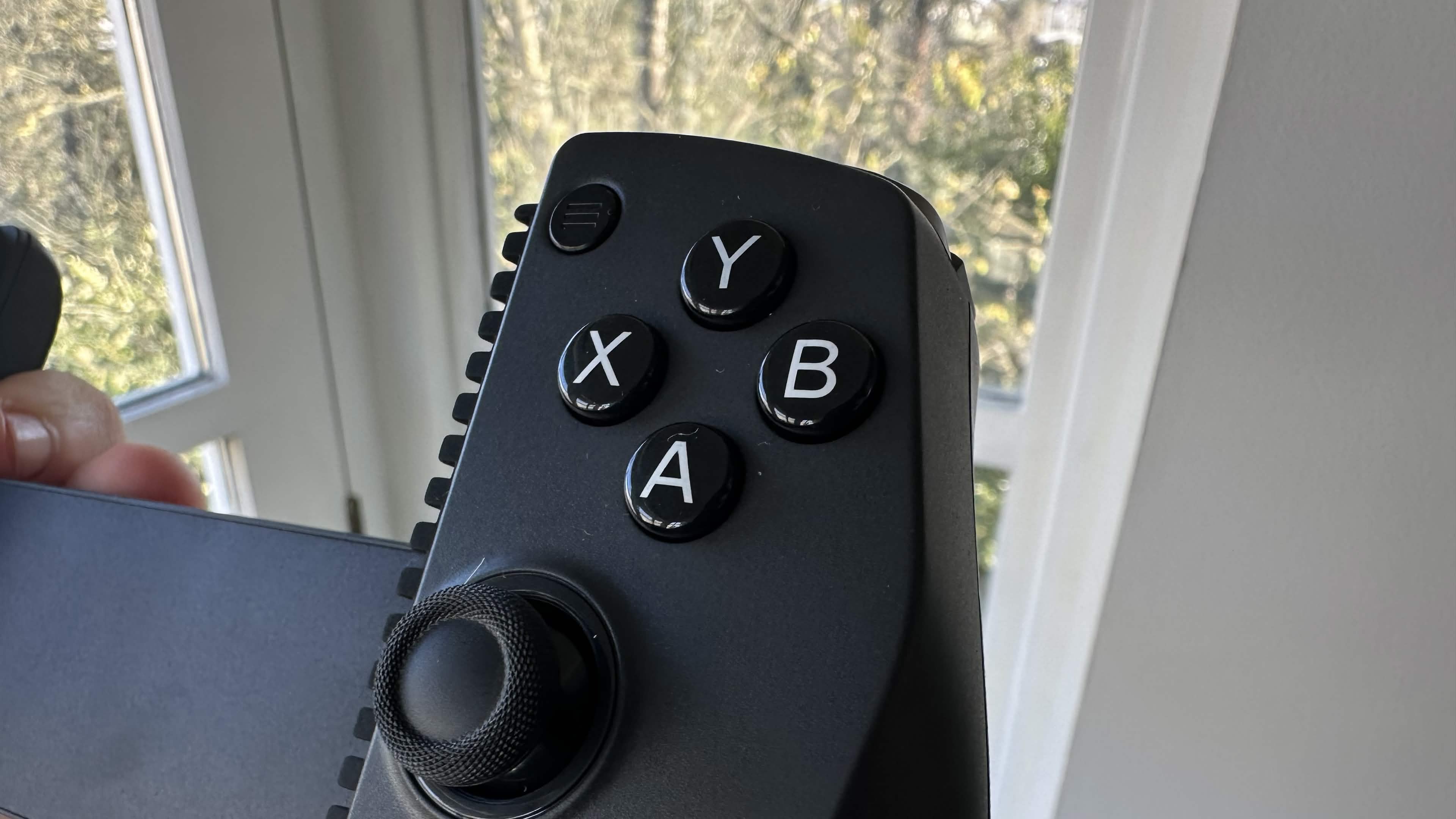 A close up of the GameSir X5s's face buttons