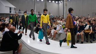 Prada S/S 2025 menswear show at Milan Fashion Week S/S 2025 featuring models on runway