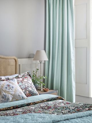 Strawberry Thief Bed Linen by Morris & Co with teal curtains in a traditional-style bedroom