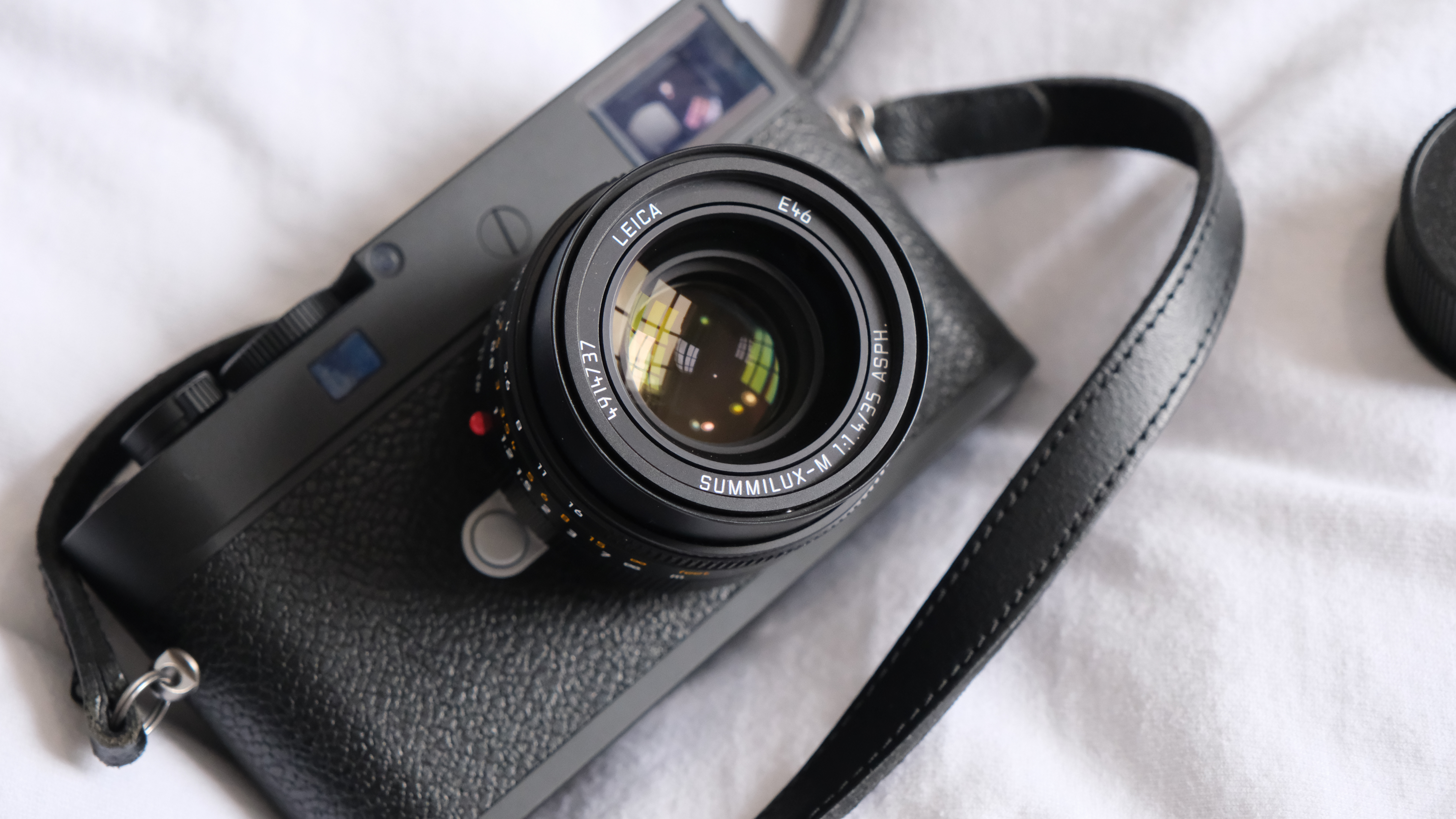 Leica M11-P digital camera on a white cloth 