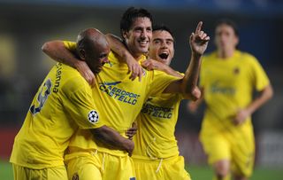 Joan Capdevila celebrates with Giuseppe Rossi and Marcos Senna after scoring for Villarreal against Aalborg in the Champions League in October 2008.