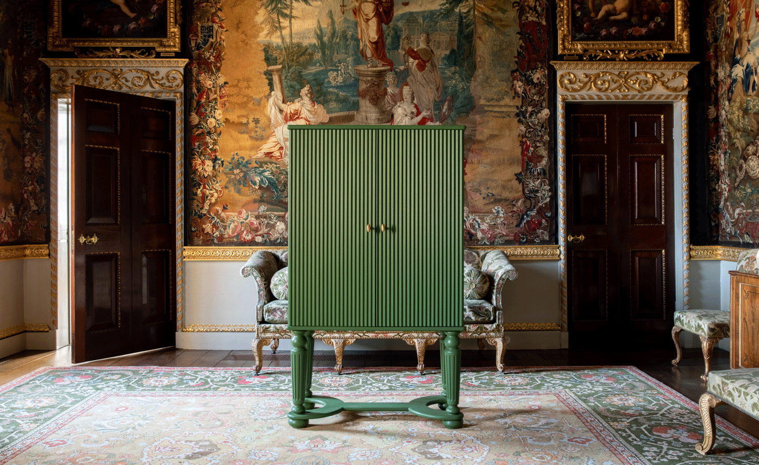 Green cabinet in an ornate room