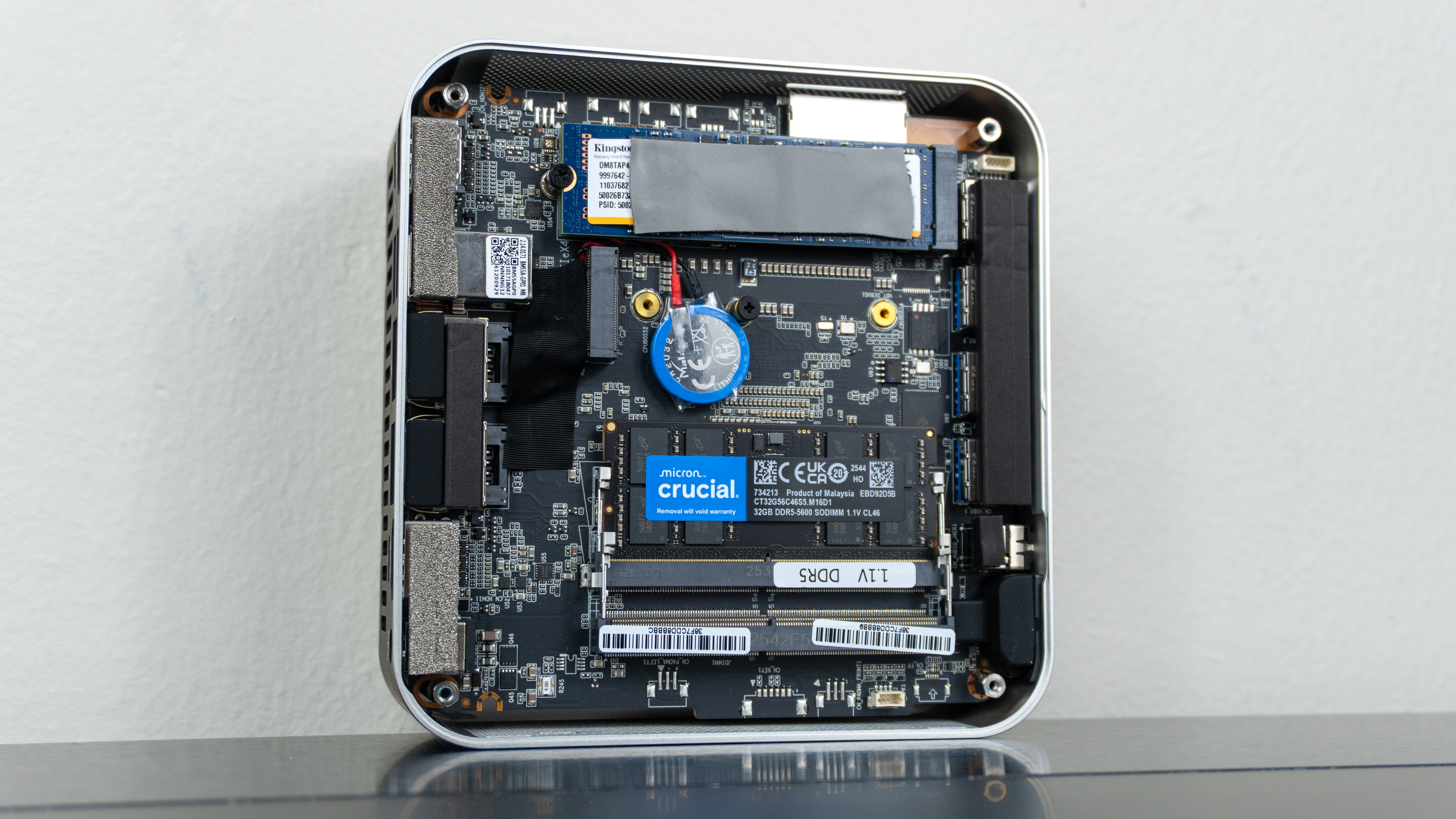 The Geekom A9 Max 2026 Edition open on a desk with its internals exposed