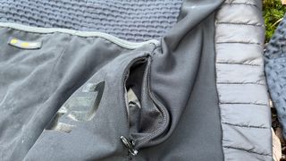 Closeup of zipped pocket of cycling jacket