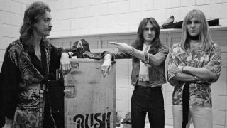 Rush posing for a photograph in 1976