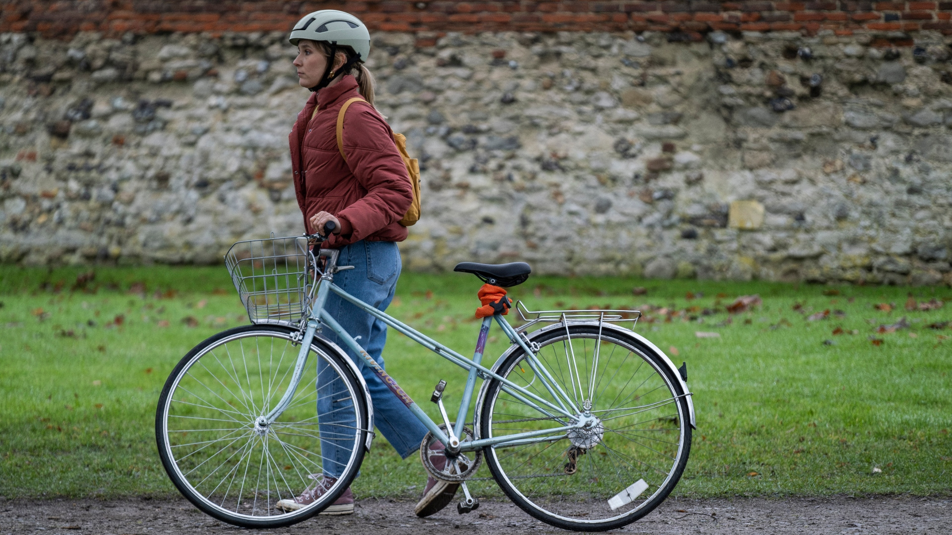 Alison walks with her bike