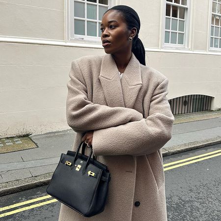 Marilyn carries an Hermes Birkin bag