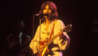 George Harrison plays his “Lucy” Les Paul onstage in 1974