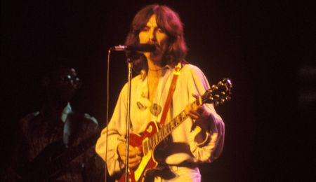 George Harrison plays his “Lucy” Les Paul onstage in 1974