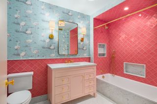 colourful pink bathroom with flamingo wallpaper