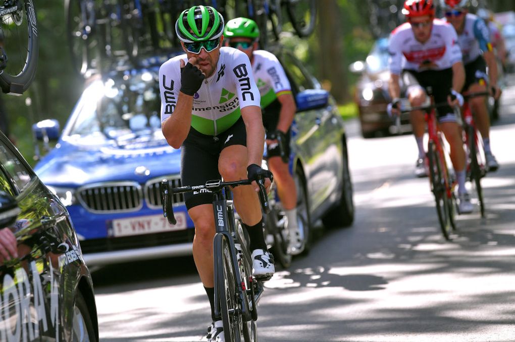 Bernie Eisel leads Mark Cavendish back to the bunch after a mechanical during stage 2 in Poland