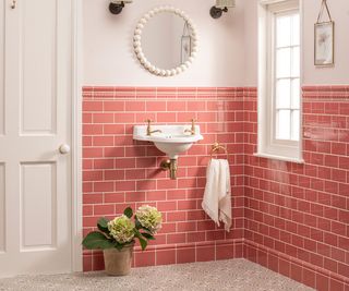pink bathroom tiles with wall hung basin