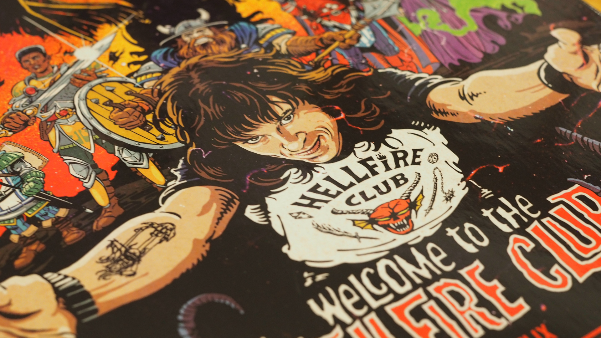 Eddie Munsen with his arms wide open, with fantasy adventurers behind him