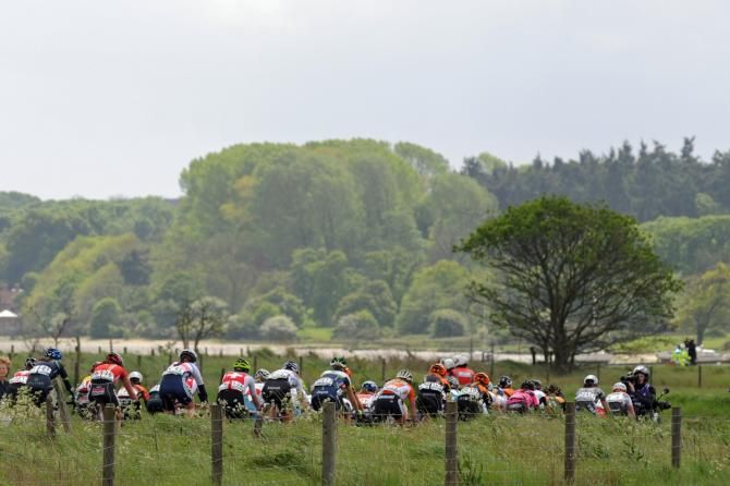 The bunch heads along the river Orwell