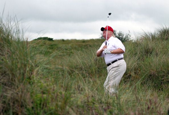 Donald Trump golfing.