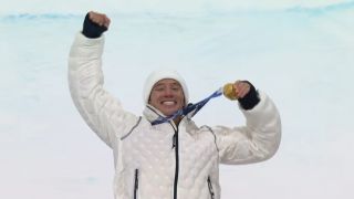 Alex Ferreira shows off his gold medal from the freeski halfpipe at the 2026 Milan Cortina Winter Olympics.