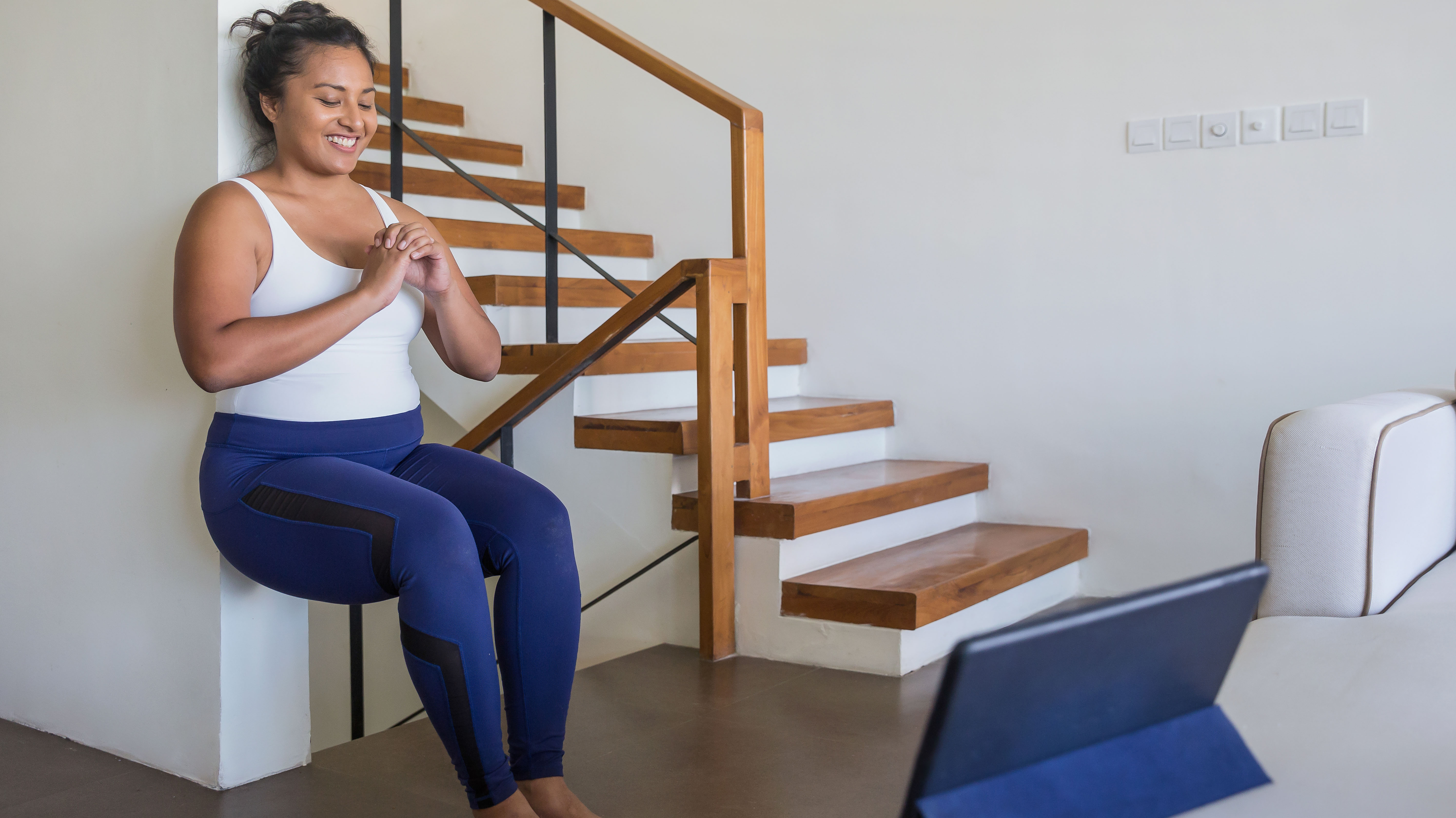 Woman doing wall sit