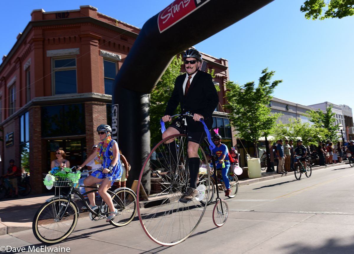 A rider on a high wheel Penny Farthing rides on Main Street prior to the women&acirc;s race