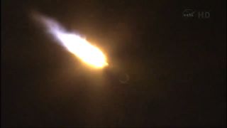 An Atlas 5 rocket carrying NASA's TDRS-K next-generation satellite streaks toward space.