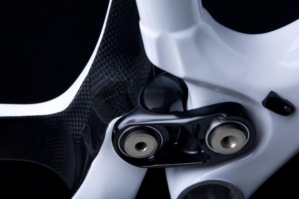 The lower link is beefed up with dual-row angular contact bearings to minimize flex.