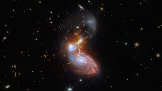 colliding spiral galaxies awash with stars.