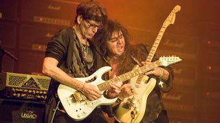 Guitarist Yngwie Malmsteen (R) and Steve Vai of Generation Axe performs on stage at Humphrey's on April 10, 2016 in San Diego, California
