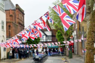 Union Jack flags line the houses getting ready for a celebration of King Charles III coronation