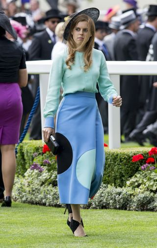 Princess Beatrice wears a turquoise shirt and polka dot colorblock skirt at the Royal Ascot in 2015