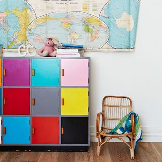 childrens room with white wall and colourful storage box