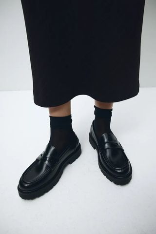 H&M shoe shot of Chunky Loafers with black socks