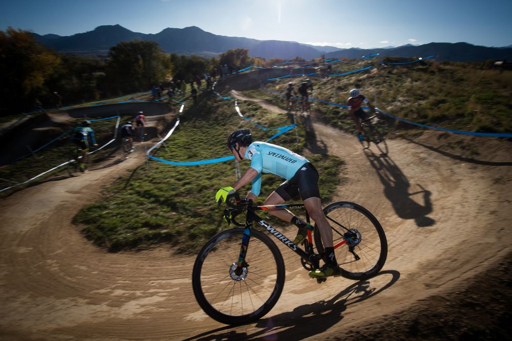The lead group of riders taking on a fast and twisty descent.