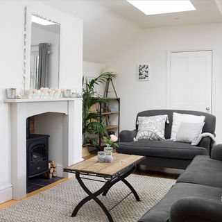 living room with white wall and fire place