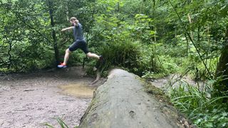 Henbury Gorge: Alex jumping a fallen trunk
