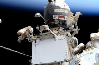 Russian cosmonauts Sergey Prokopyev (at right) and Dmitry Petelin prepare a large radiator for its move from the Rassvet mini-research module to the Nauka multipurpose laboratory module during a Nov. 17, 2022 spacewalk outside of the Russian segment of the International Space Station.