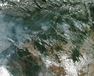 This satellite photo of South America shows the smoke above the fires in the Amazon rainforest on Aug. 13, 2019. The image was taken the Moderate Resolution Imaging Spectroradiometer (MODIS) on NASA’s Aqua satellite.