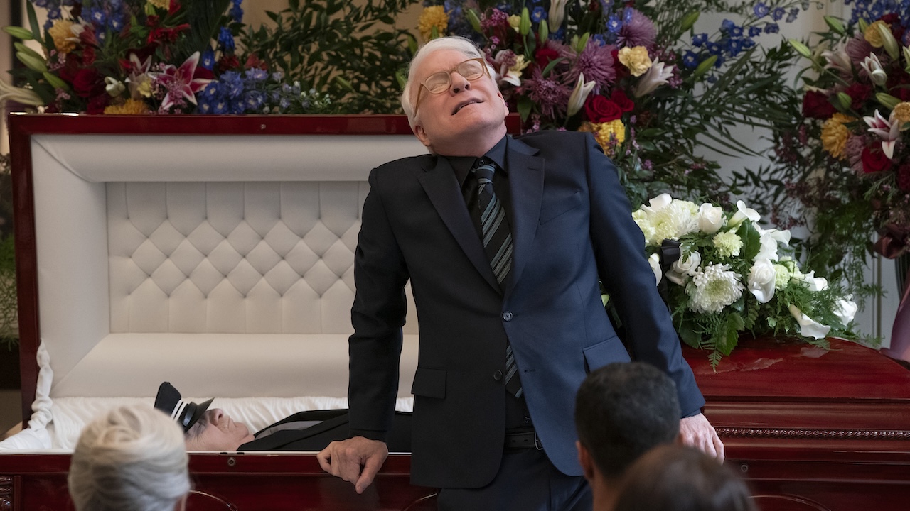Charles standing in front of coffin faking emotional pain in Only Murders in the Building Season 5 premiere