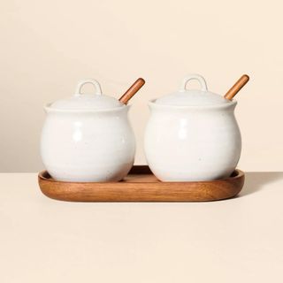 A ceramic salt and pepper set with spoons