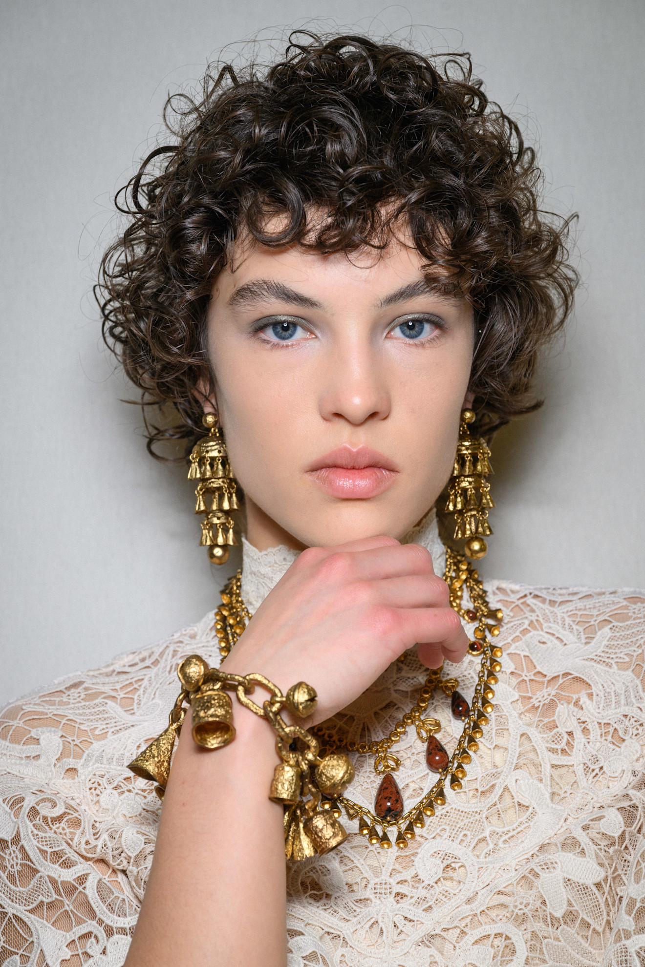 Person with curly baby bangs.
