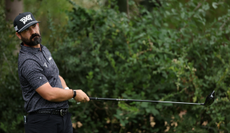 Chad Ramey hits a driver off the tee