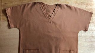 Brown scrubs on table