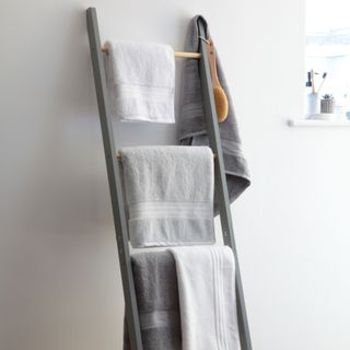 Bath towels hanging on wooden ladder