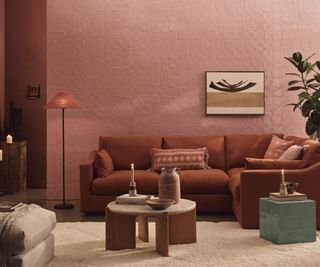 A living room with walls covered in square arth-tone tiles