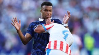 France's Kylian Mbappe being pushed by Paraguay's Juan Jose Caceres at World Cup 2026