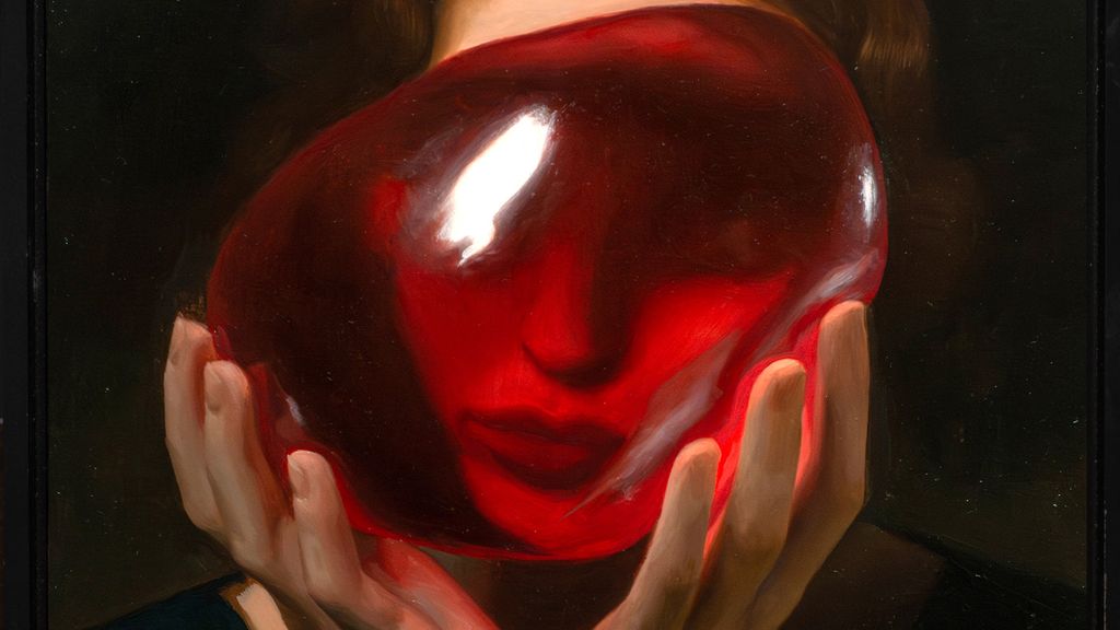 Woman looking through a red orb