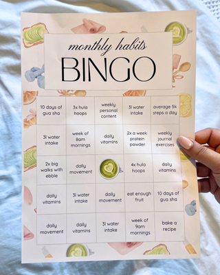 A wellness bingo card featuring monthly habits and a series of pastel watercolour graphics